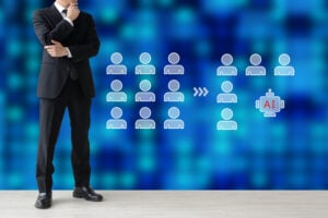 A businessman considering whether to reduce employees or introduce AI