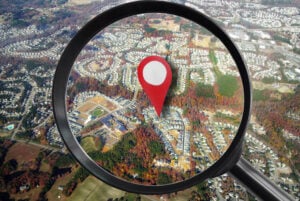 leaking data leads to location information - picture shows magnifying glass over a house in a neighborhood, satellite view