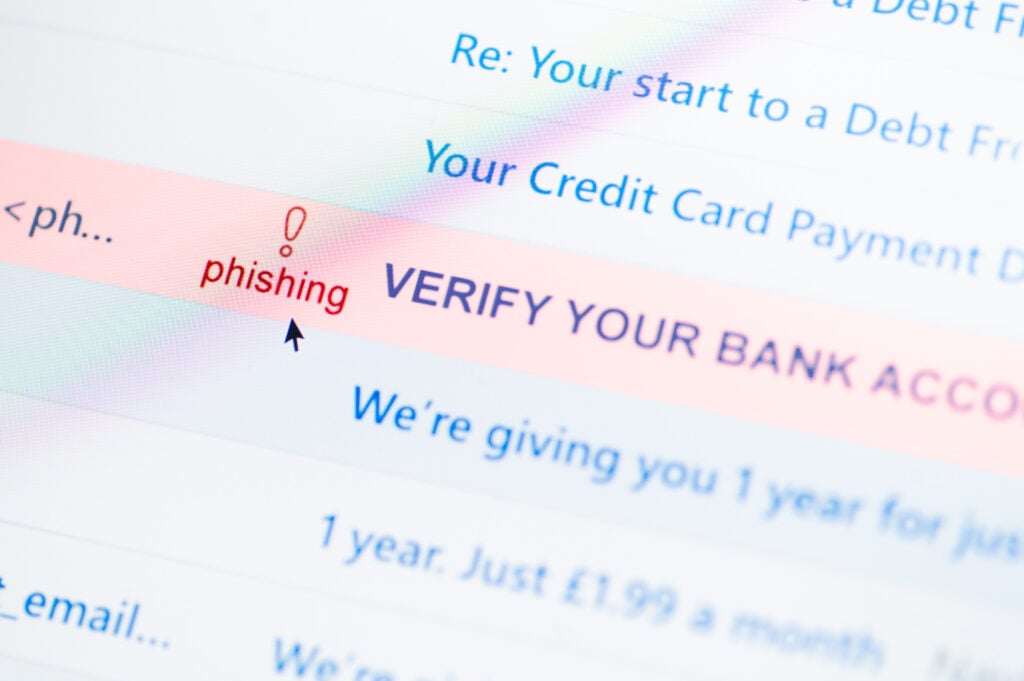 phishing Suspicious email message marked as phishing attempt and bank account verification scam concept.