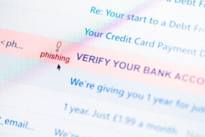 phishing Suspicious email message marked as phishing attempt and bank account verification scam concept.